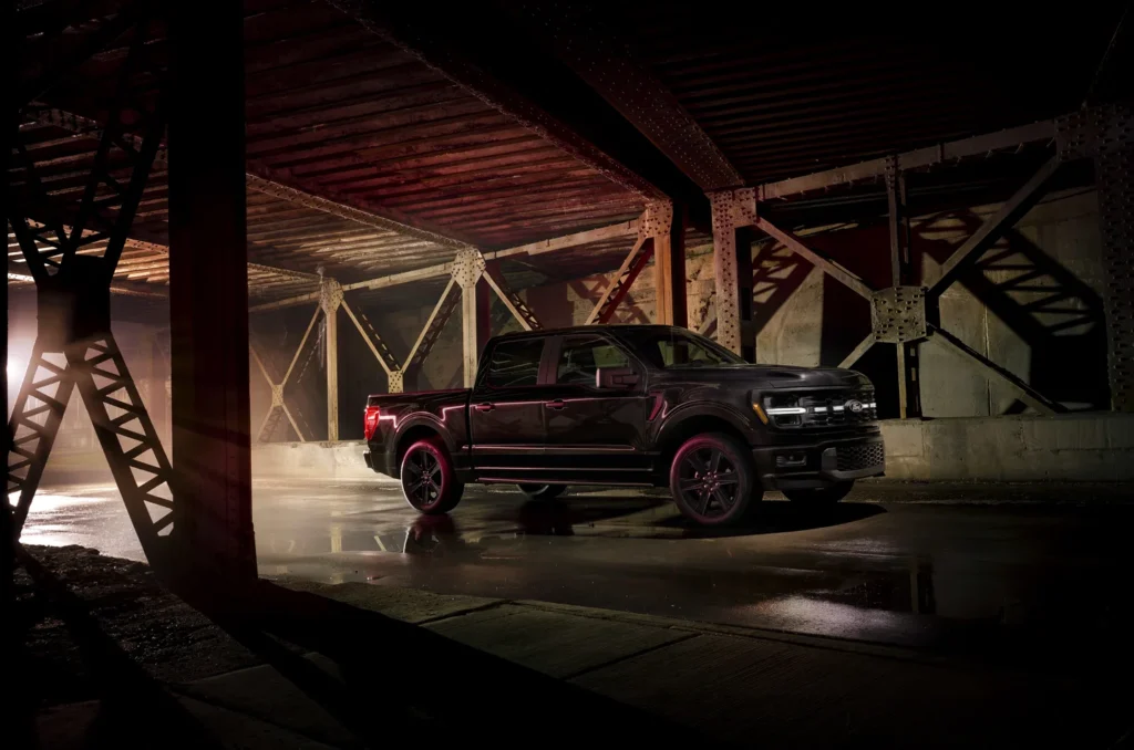 Side profile of 2025 Ford F-150 Lobo with lowered rear and glossy black trim.