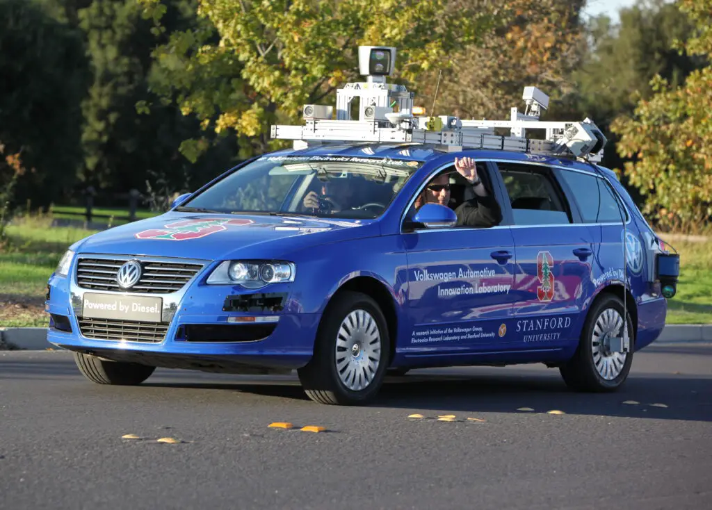 Test vehicle demonstrating Level 3 Driver Assistance Systems with rooftop LiDAR and autonomous navigation.