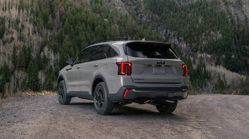 2025 Kia Sorento SUV in a mountainous off-road setting.