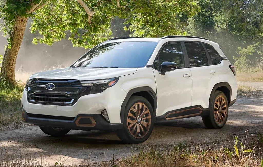 Side view of white 2025 Subaru Forester Hybrid Review showing body lines and hybrid detailing.