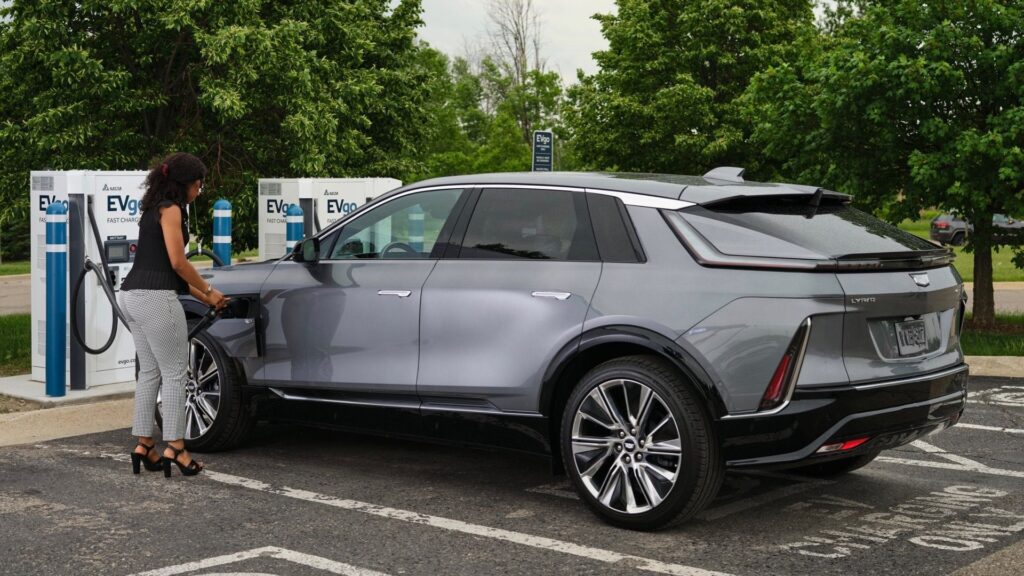 Cadillac Lyriq charging at an EV station.