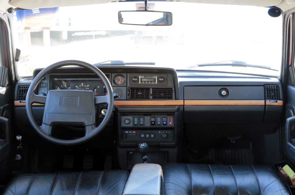 Volvo 240 interior view showing dashboard and steering wheel