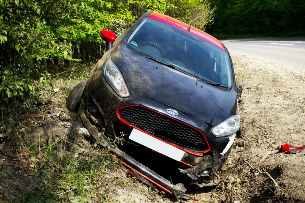 GAP Insurance Explained the Crashed car on roadside showing the need for GAP Insurance.