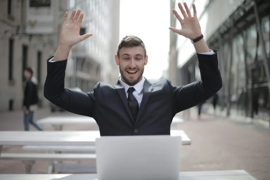 Happy man celebrating after getting approval to finance a car with bad credit.
