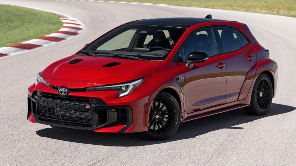 2026 Toyota GR Corolla red hot hatch front view on racetrack.