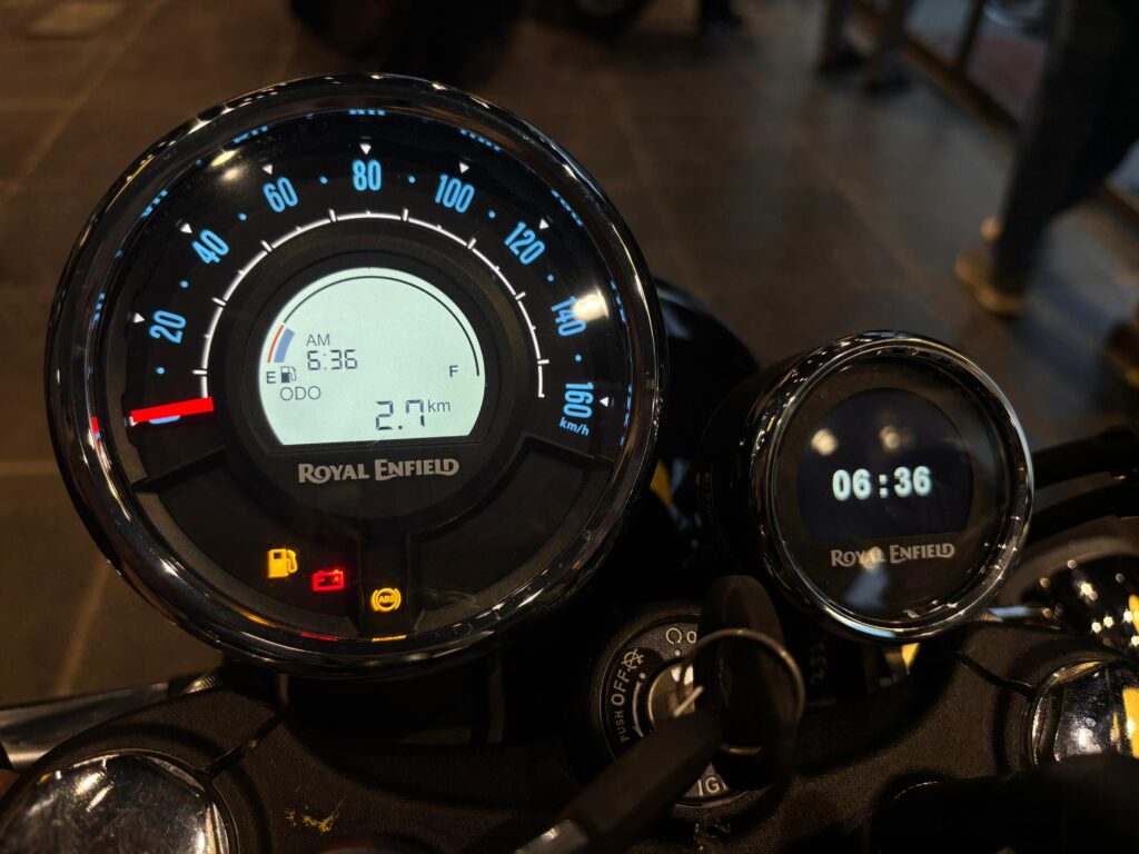 Royal Enfield Meteor 350 2025 instrument cluster showing semi-digital speedometer, odometer reading, and Tripper Navigation pod.