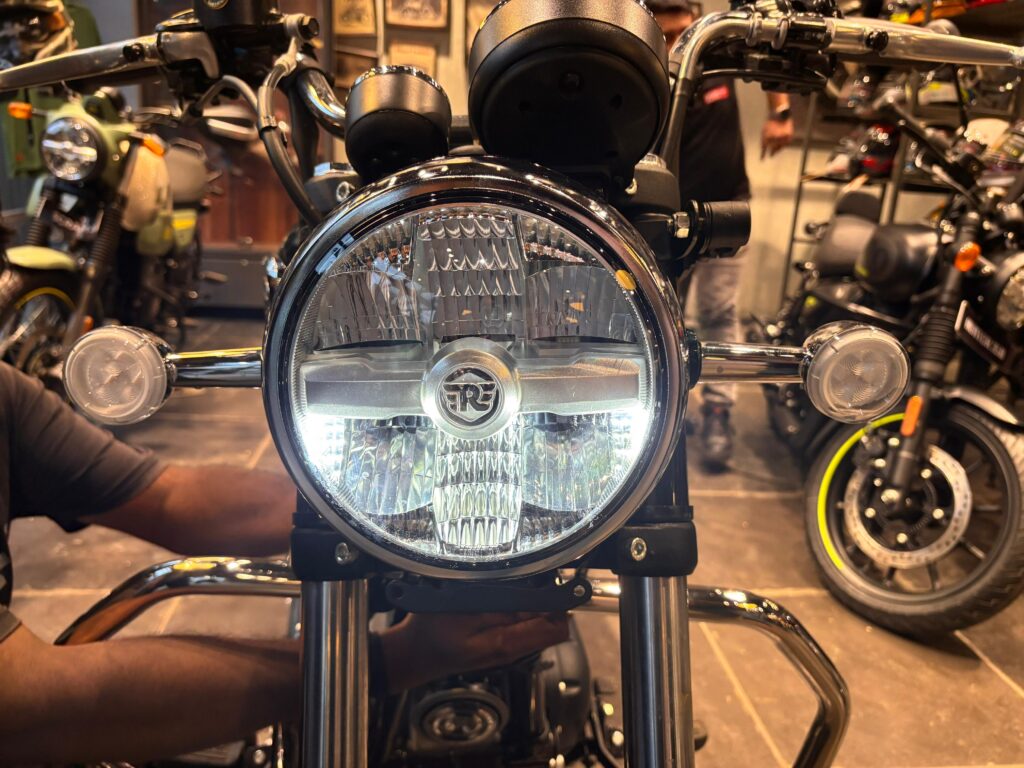 Front headlamp view of the Royal Enfield Meteor 350 2025 with LED light, RE branding, and classic round indicators.