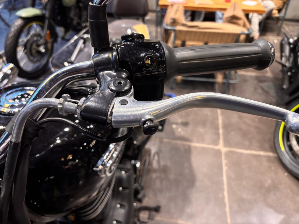 Close-up view of the Royal Enfield Meteor 350 2025 handlebar and clutch lever, emphasizing its solid construction, ergonomic grip, and classic design.
