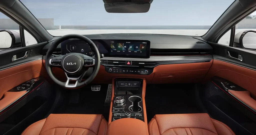 The 2025 Kia K5 's front seats are roomy, have plush upholstery, and are set up in a contemporary manner that exudes comfort and elegance.