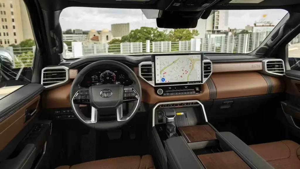 2026 Toyota Tundra interior showing premium brown leather seats, large touchscreen display, and modern dashboard design