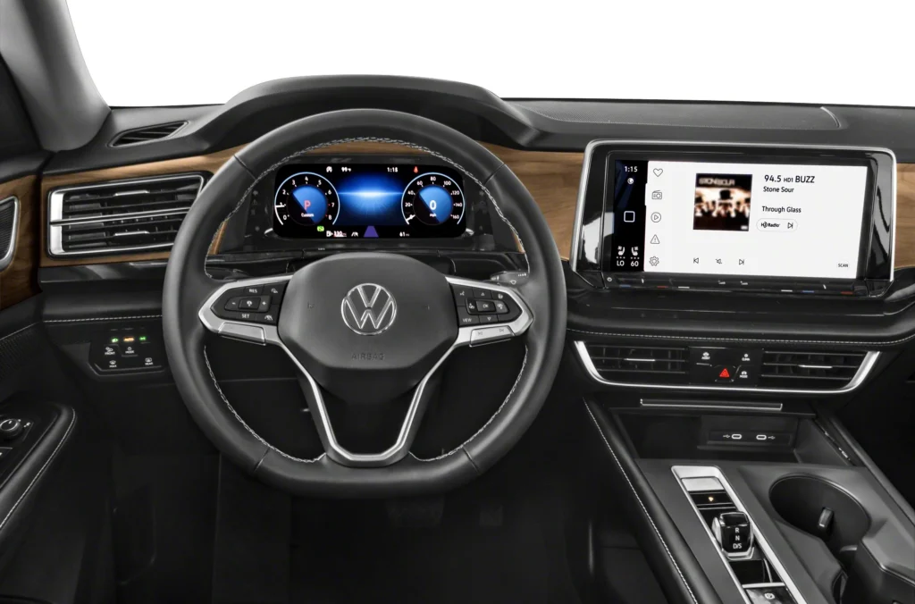 Interior of 2026 Volkswagen Atlas showing three rows of seats, large infotainment screen and premium cabin materials